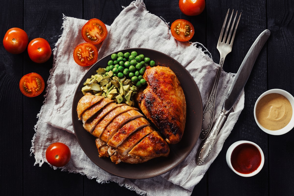 Man preparing healthy meal with vegetables and proteins